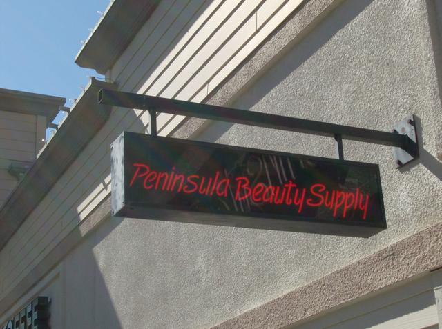 Peninsula Beauty Blade sign with neon lettering, clear acrylic sign faces, and steel bracket Redwood City, California, San Francisco Bay Area, San Mateo County 3