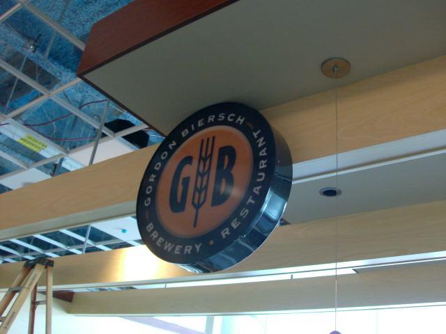 Gordon Biersch Brewery & Restaurant Mineta San Jose International Airport Sign cabinet with internal neon illumination, acrylic sign faces, and full color vinyl graphics. San Jose, California, San Francisco Bay Area, Santa Clara County 4