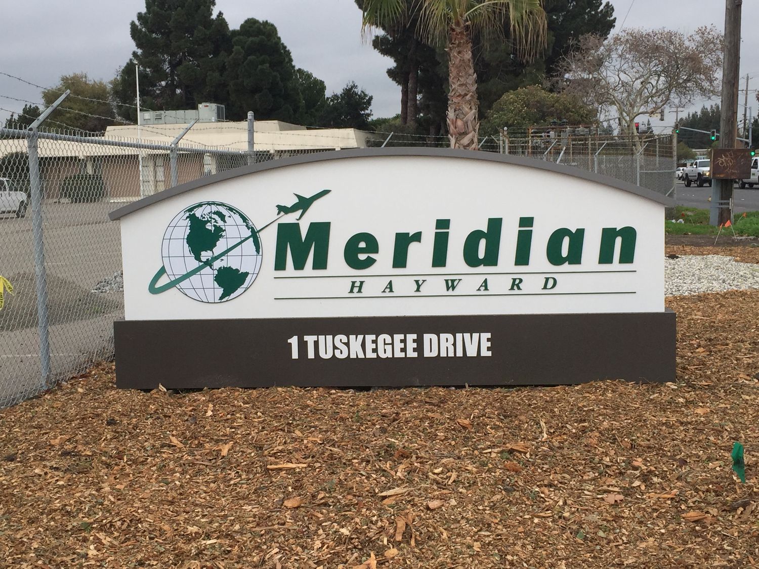 Monument, Aluminium body with individual 1/2" cut acrylic letter logo. Pipes concreted inground. In Hayward, CA. Alameda County dnsd_IMG_2775