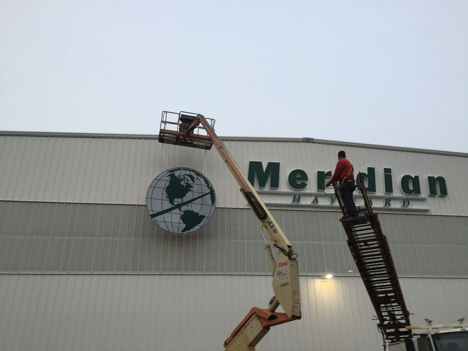 Logo LED lighted, 11' diameter being installed in Hayward, CA. Alameda County dnsd_IMG_2785